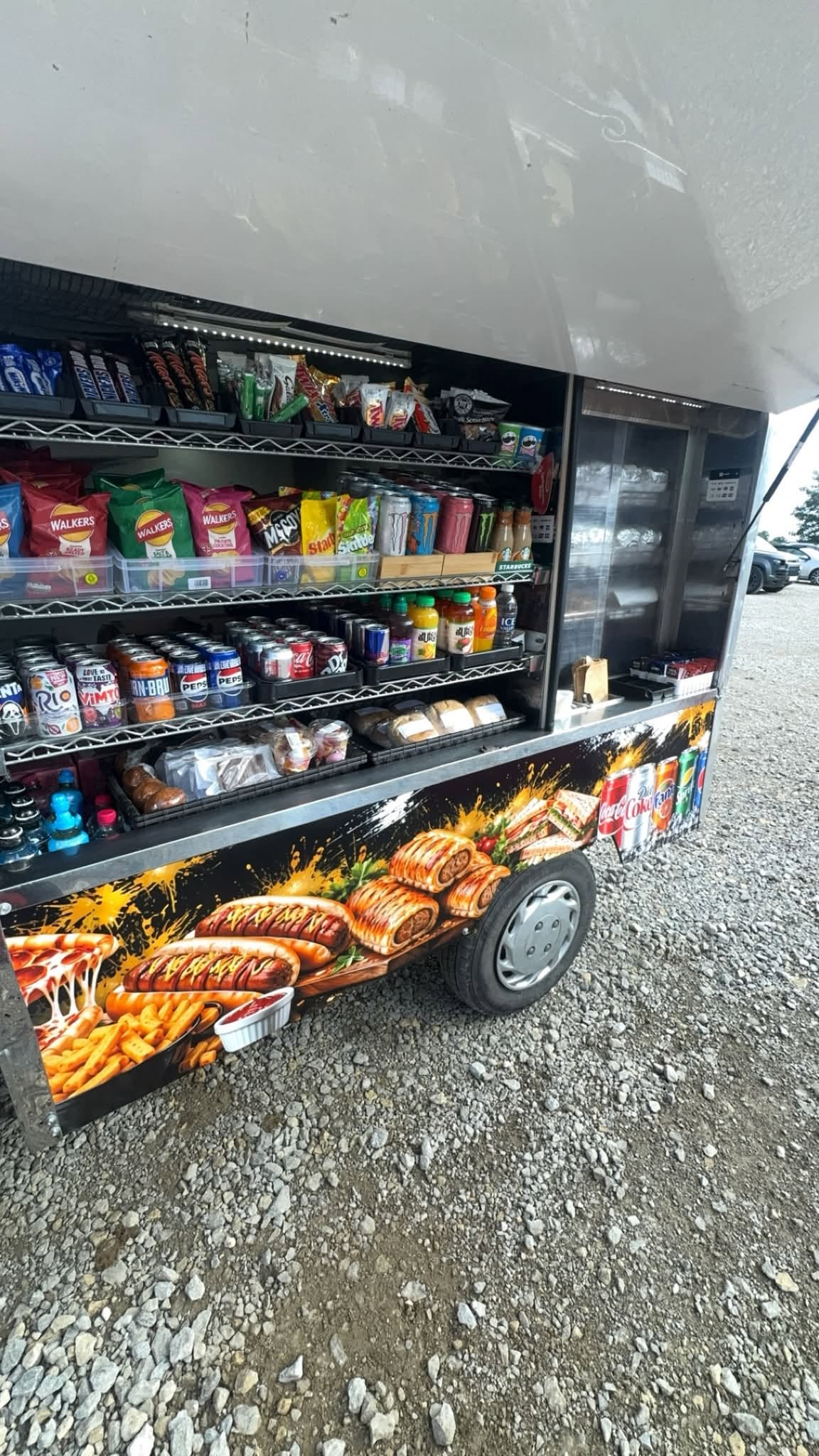 Biggies Snack Shack van with its serving hatch open and food and drinks on display